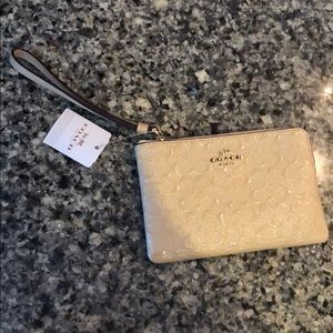 COACH CREAM WRISTLET